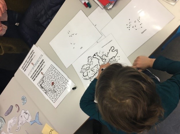 child drawing a map